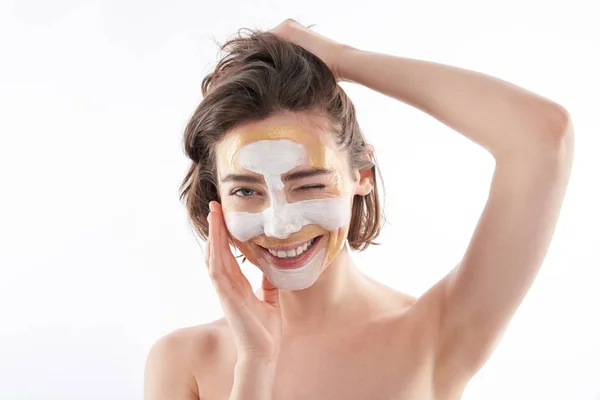 Portrait of happy winking female with face mask — Stok Foto