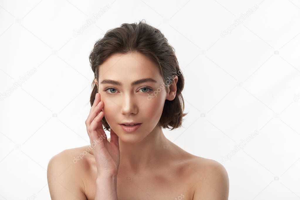 Close up of brunette blunt bob woman on white