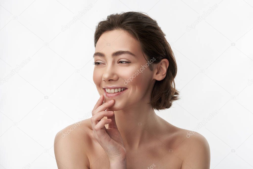 Close up of happy brunette woman on white