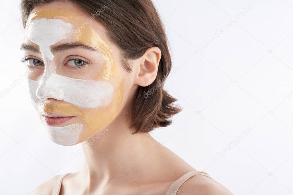 Portrait of tender pretty woman with face mask