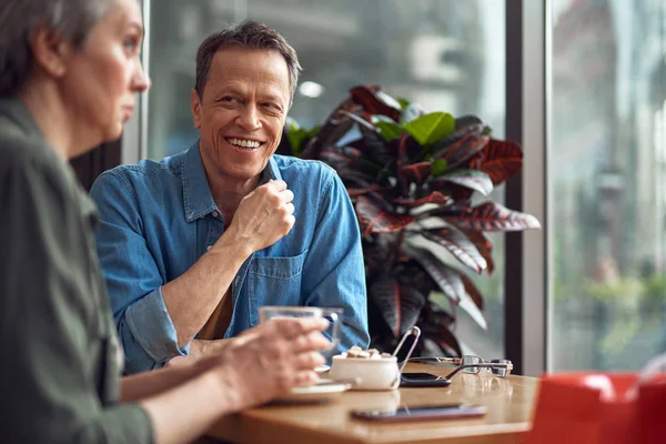 Happy mature man looking to woman with pleasure — Stock Photo, Image