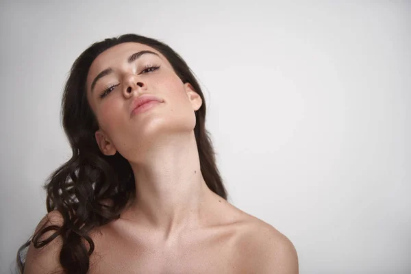 Portrait of graceful brunette woman on white — Stock Photo, Image