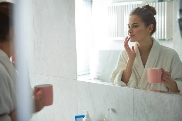 Young smiling lady tenderly touching her lips — Stock Photo, Image