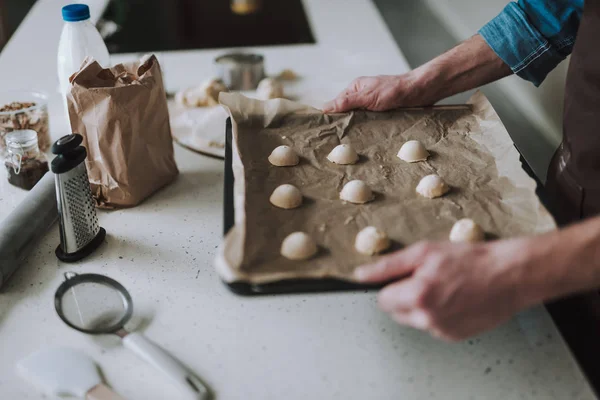 Sheet pan with raw pastry on baking paper