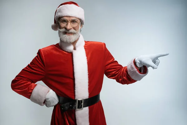 Senior Santa Claus pointing index finger away — Stock Photo, Image