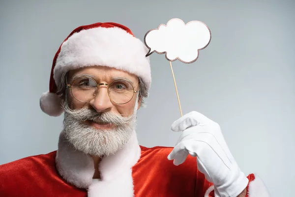 Santa Claus with thought bubble in hand — Stock Photo, Image