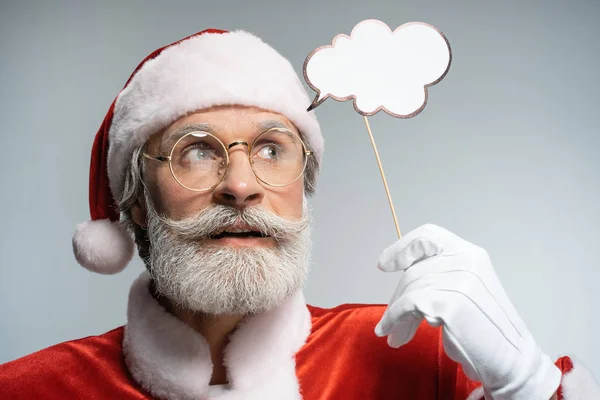 Père Noël avec bulle de pensée à la main — Photo