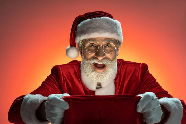 Santa Claus holding sack with presents in hands — Stock Photo, Image