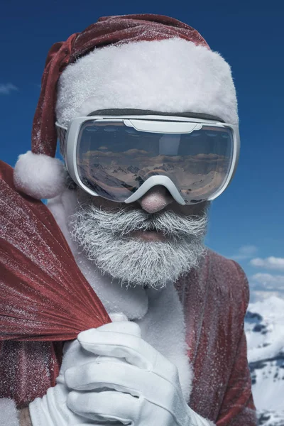 Elderly Santa Claus in mountains with sack — Stock Photo, Image