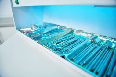 Dental instruments are undergoing sterilization before use clipart