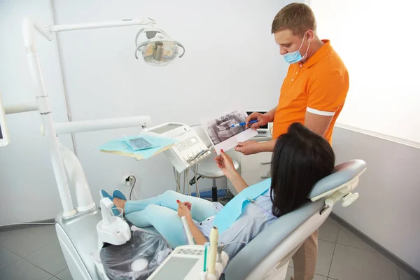 Young woman holding dental x-ray in clinic — Stock Photo, Image