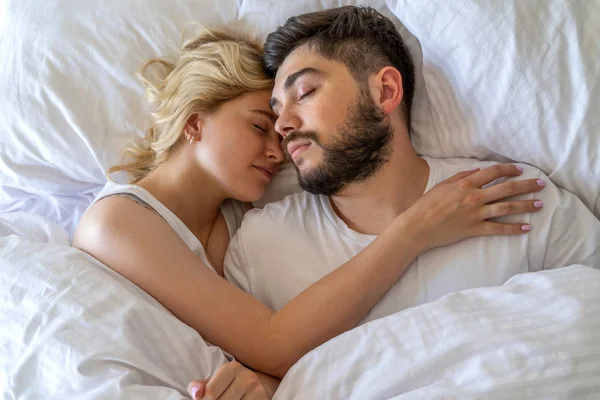 Pretty woman is sleeping near her boyfriend — Stock Photo, Image