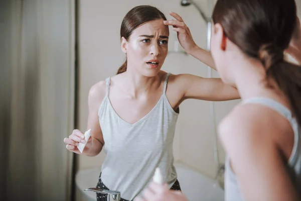 Stressed young woman having some skin problems — Stock Photo, Image