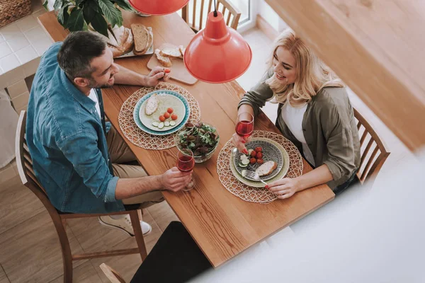 Happy wife and husband having dinner at home — Stock Photo, Image