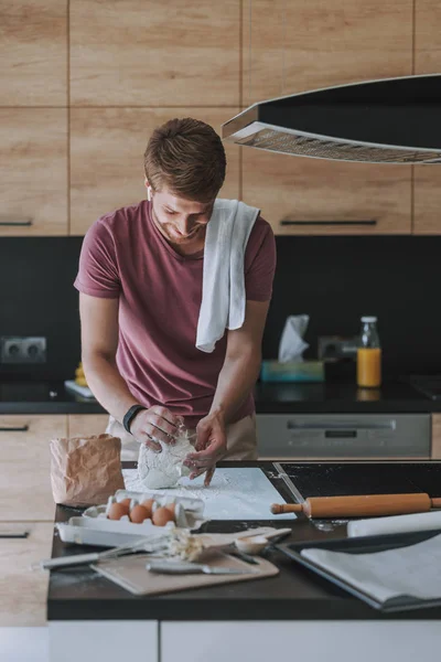 Smiling cook being happy to bake something — Stock Photo, Image