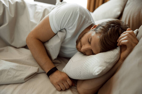 Man having a deep sleep in the morning