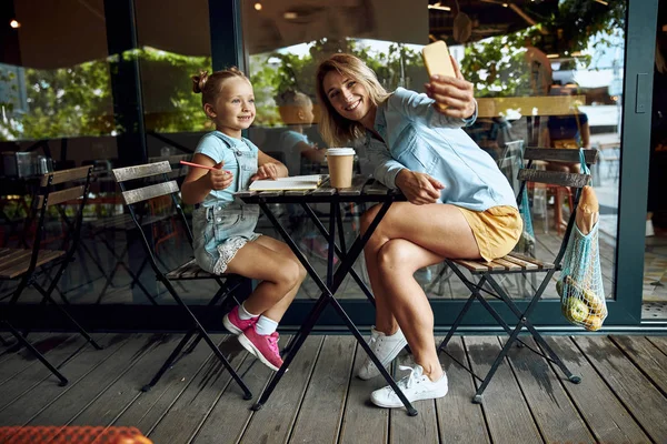 Taking selfies outdoors and smiling stock photo — Stock Photo, Image