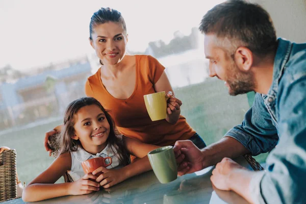 Delighted young family resting at home together — ストック写真