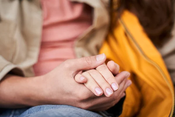 Loving young man holding hand of his wife — Stok Foto