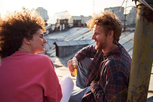 Happy young couple dating on urban roof — Stock Photo, Image