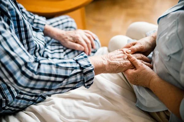 Wife massaging husband hands — Stock Photo, Image