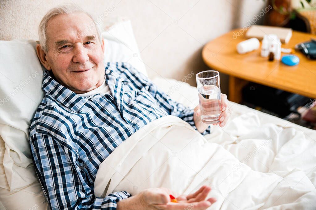 Mature man with supplements pill