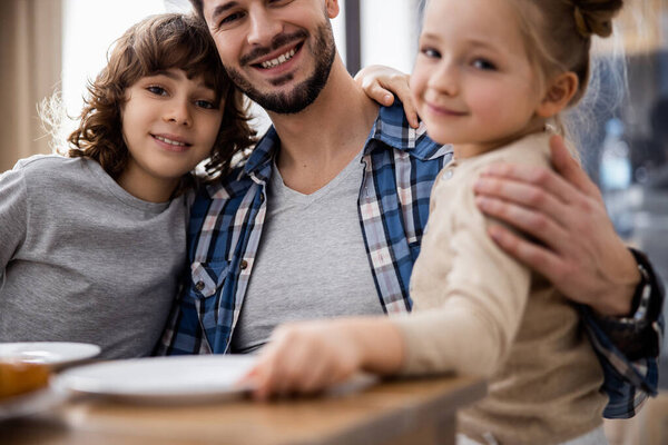 Father with children on both sides of him