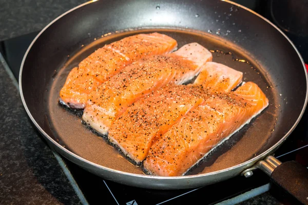 Salmon in pan background