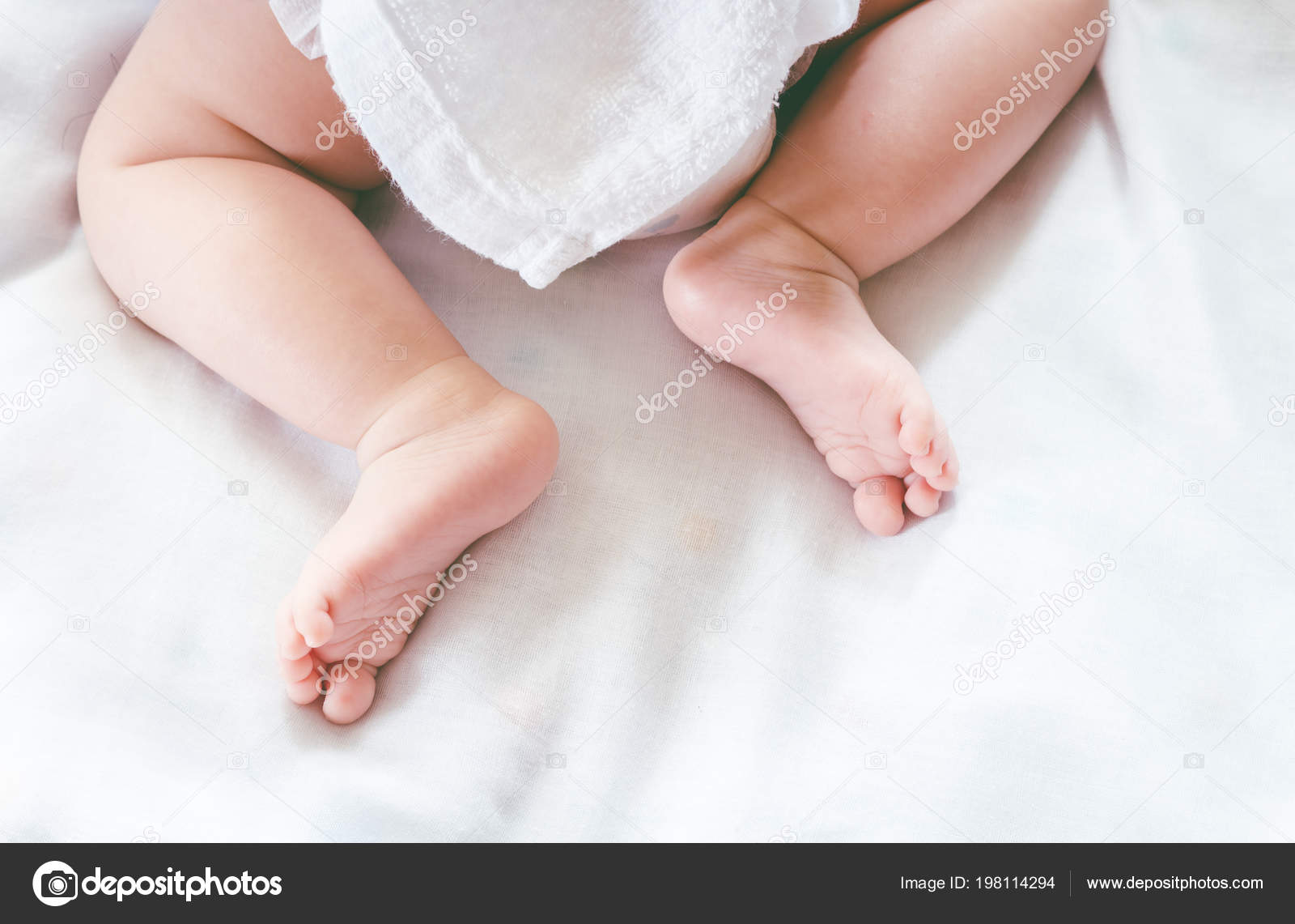 New Born Baby Feet Stock Photo by ©assumption111 198114294