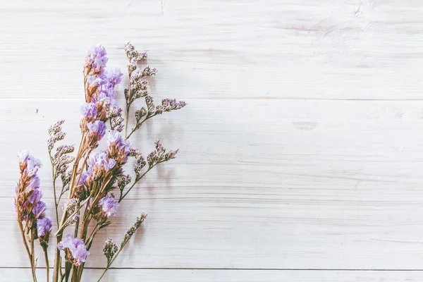 Dried flower on wooden table