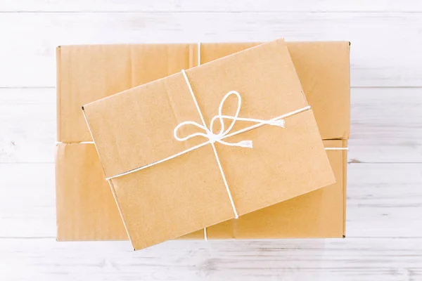 Packaged boxes delivery on wooden background