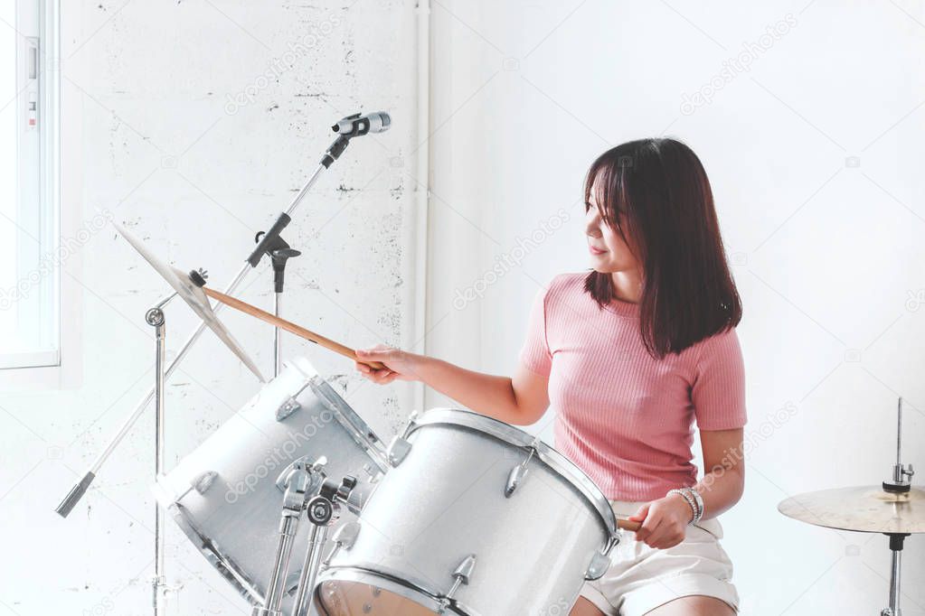 Young teen playing the drums