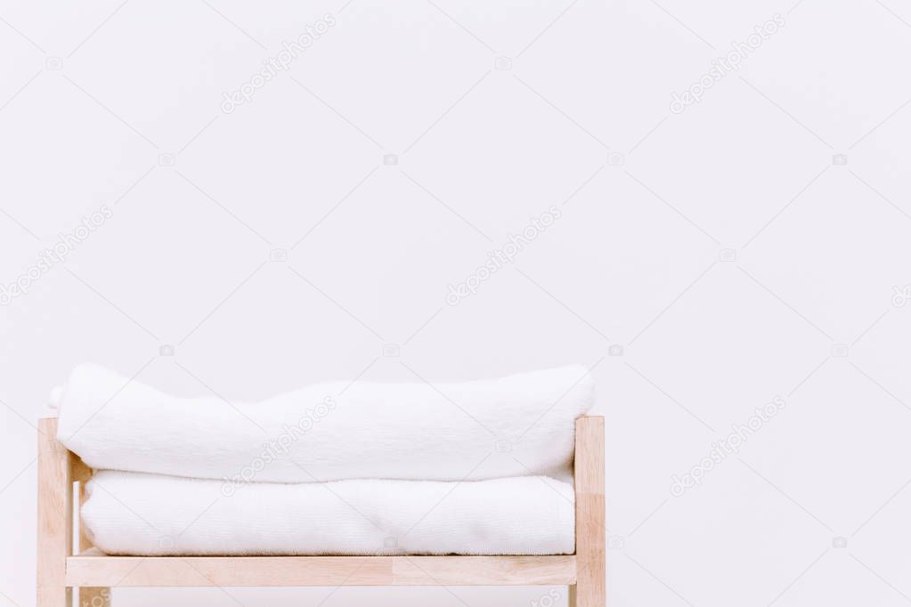 Stack towels on wooden background
