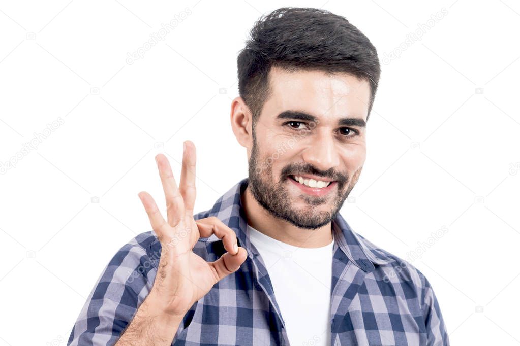 Young man makes gesture OK isolated on white background
