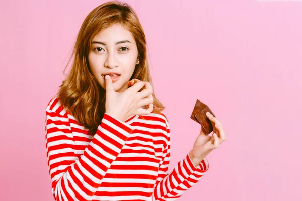 Beautiful Woman Eating Dark Chocolate Pink Background — Stock Photo, Image