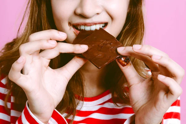 Beautiful Woman Eating Dark Chocolate Pink Background Royalty Free Stock Images