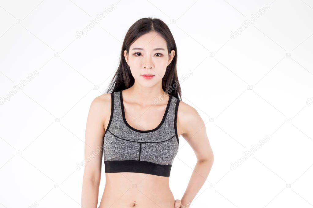 Young fitness woman on white background