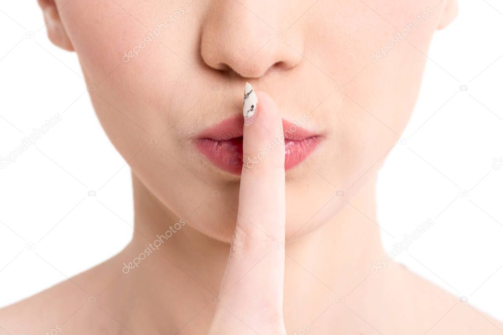 Business woman quiet gesture with finger isolated on white background