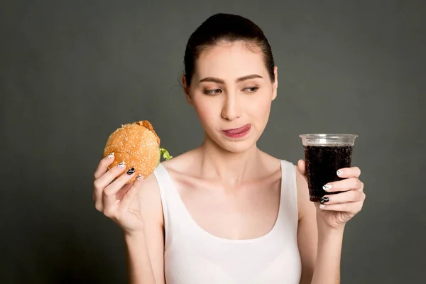 Young Woman Eating Hamburger Cola Gray Background Junk Food Fast — Stock Photo, Image