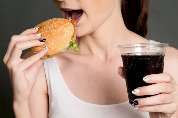 Young Woman Eating Hamburger Gray Background Junk Food Fast Food — Stock Photo, Image