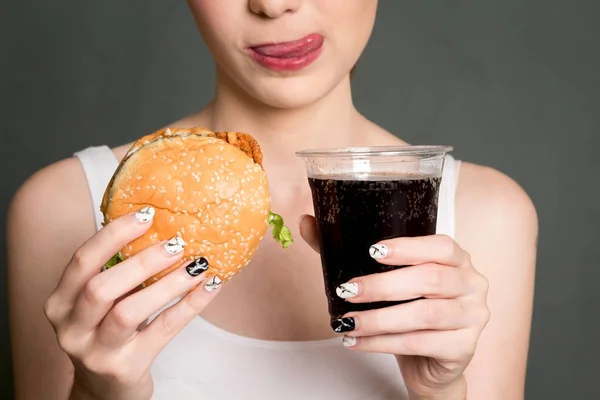 Young Woman Eating Hamburger Cola Gray Background Junk Food Fast — Stock Photo, Image
