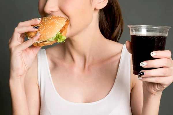 Young Woman Eating Hamburger Gray Background Junk Food Fast Food — Stock Photo, Image