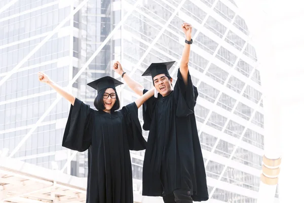 Two Happy Students Celebrating Successful Graduation Campus Building Background — Stock Photo, Image