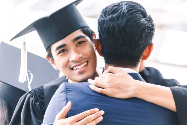 Students Celebrating Successful Graduation Hugging Friend — Stock Photo, Image