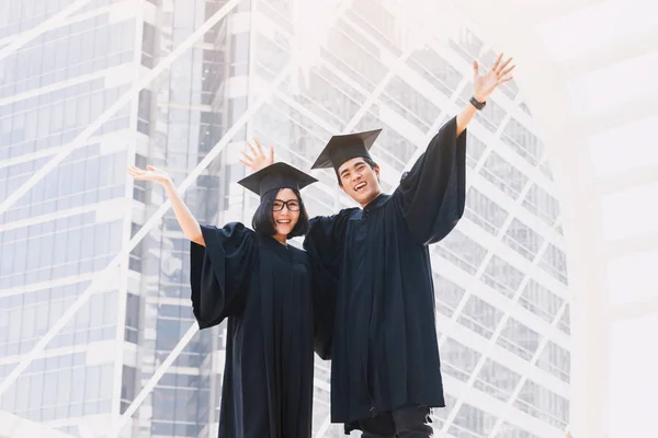Two Happy Students Celebrating Successful Graduation Campus Building Background — Stock Photo, Image