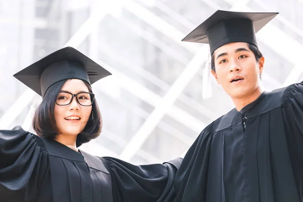 Two Happy Students Celebrating Successful Graduation Campus Building Background — Stock Photo, Image