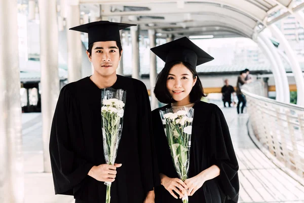 Two Happy Students Celebrating Successful Graduation Campus Building Background — Stock Photo, Image