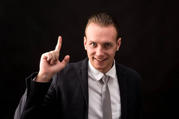 Businessman Pointing Copy Space Isolated Black Background — Stock Photo, Image