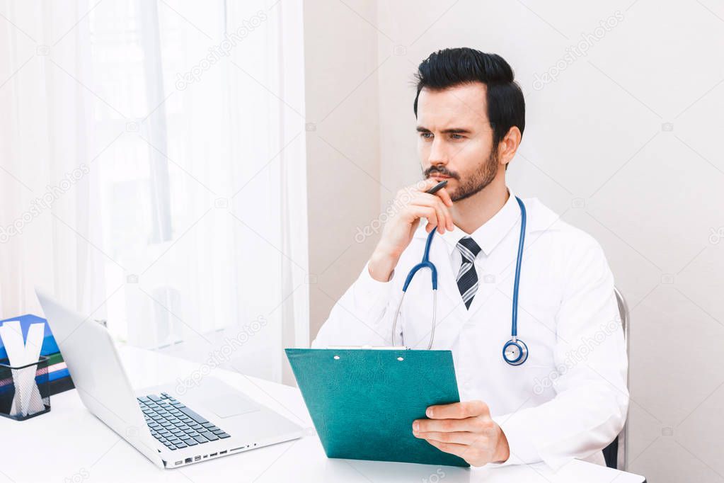 Doctor and stethoscope working with laptop computer in hospital.healthcare and medicine