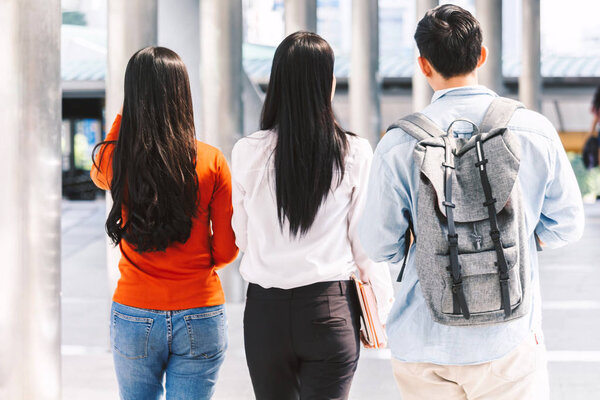 Group of students holding notebooks outdoors.Education concept